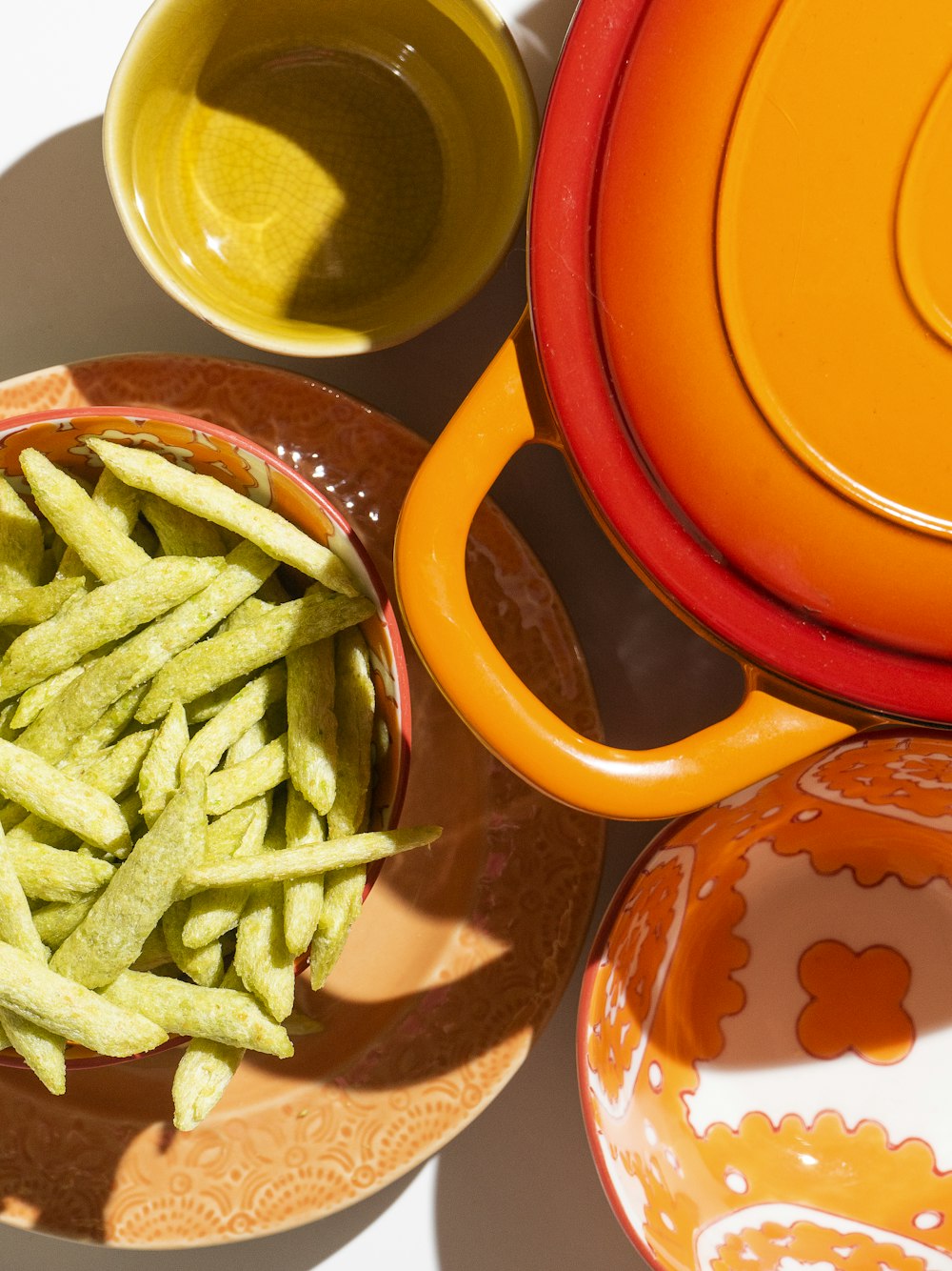 green vegetable on red ceramic plate