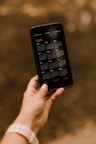 person holding black android smartphone
