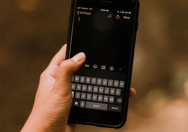 person holding black android smartphone