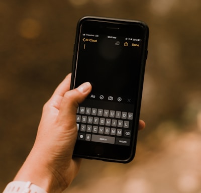 person holding black android smartphone