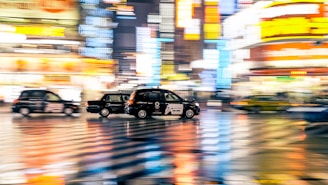 A vibrant image of a city with cars and people using a ride-sharing app.