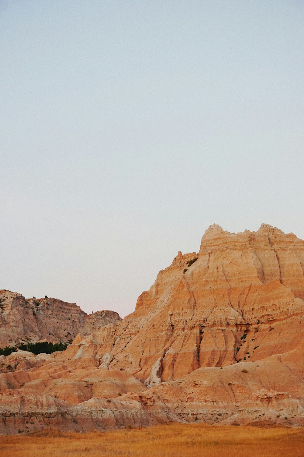 brown rocky mountain under white sky during daytime