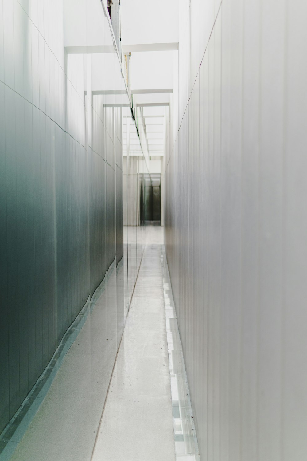 white hallway with green walls