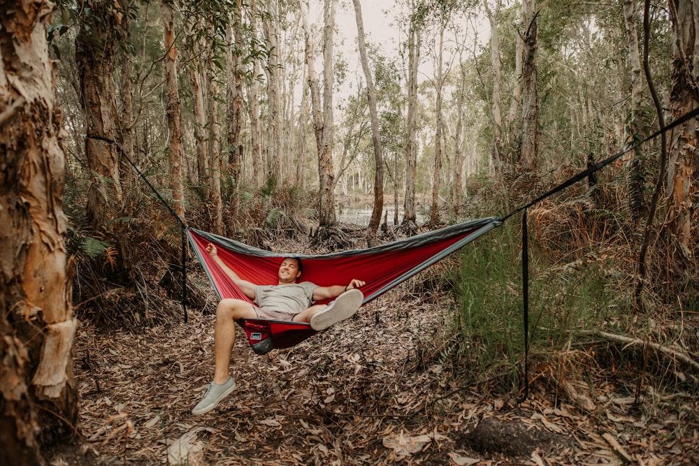 woman in red shirt lying on hammock