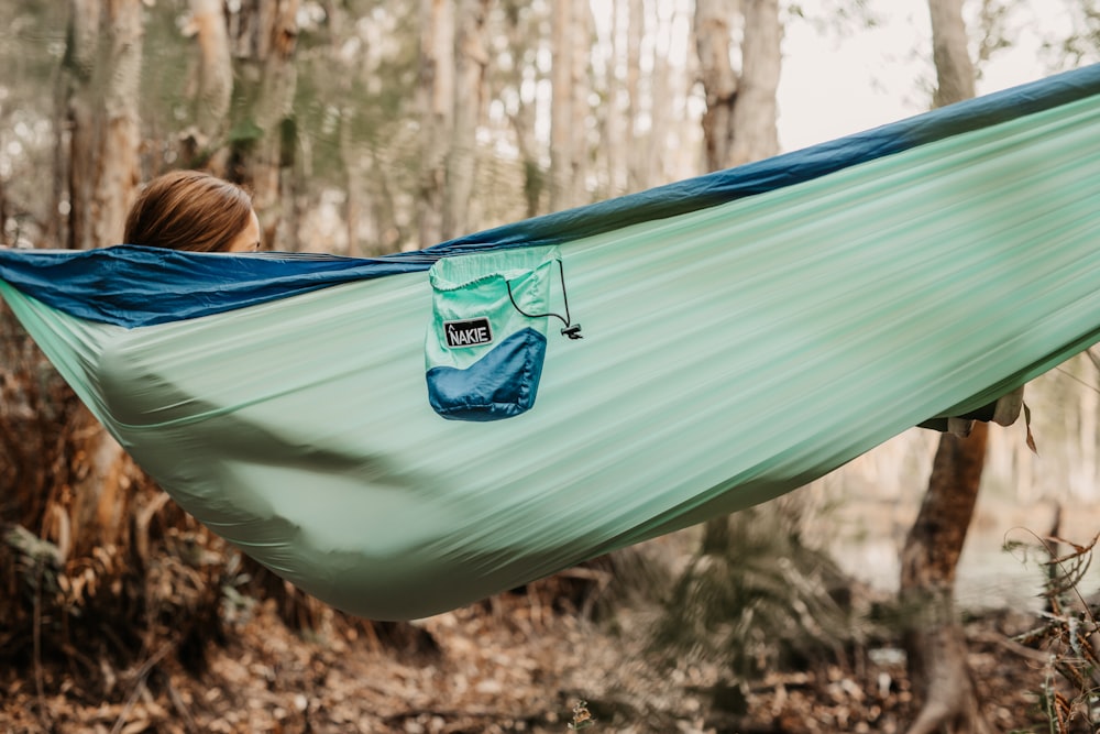 woman in blue shirt on hammock