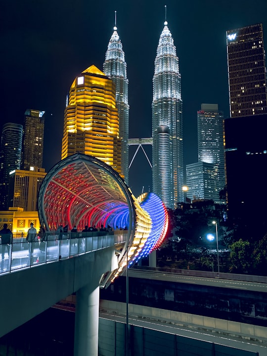 lighted city buildings during night time in Petronas Towers Malaysia