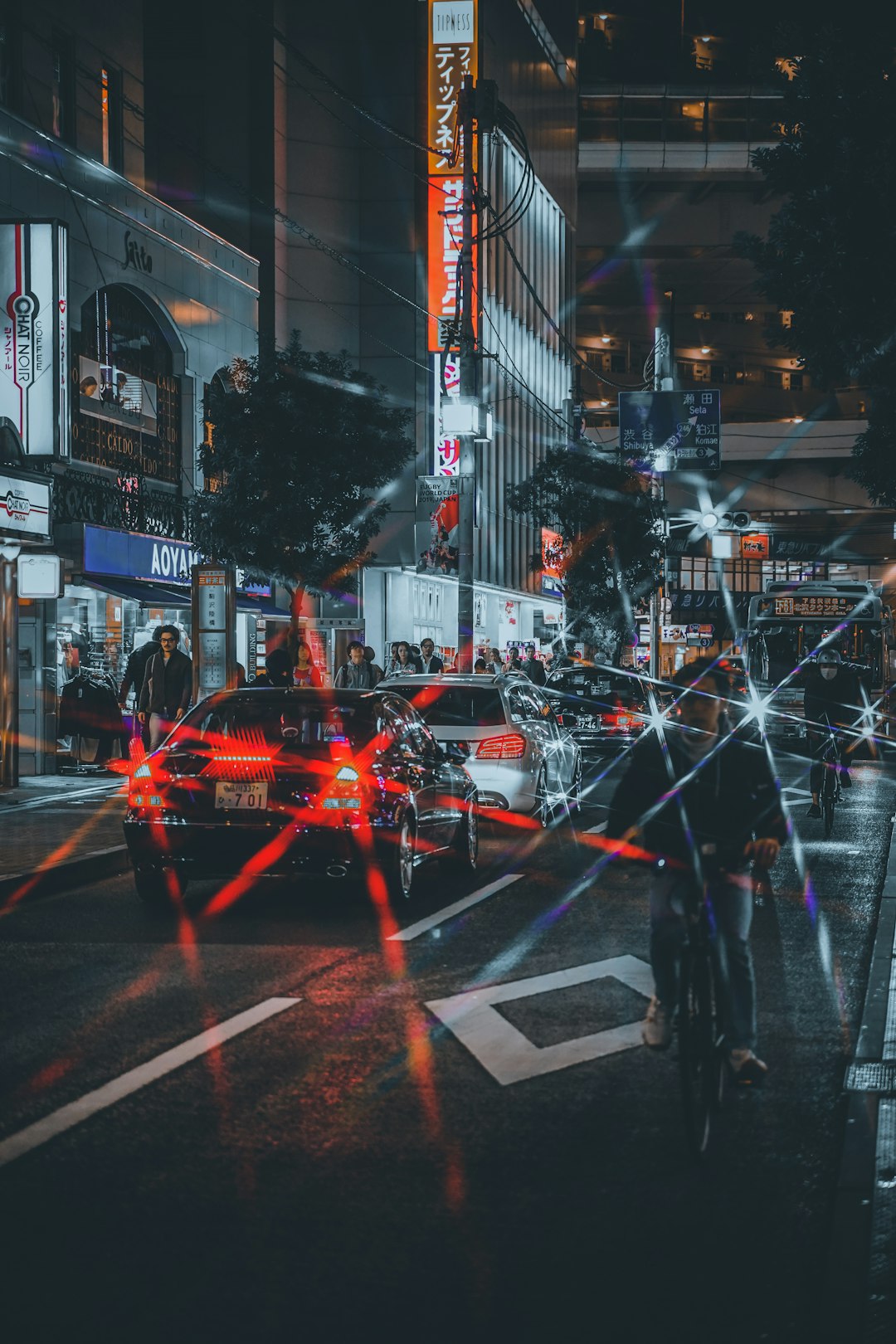 red car on road during night time