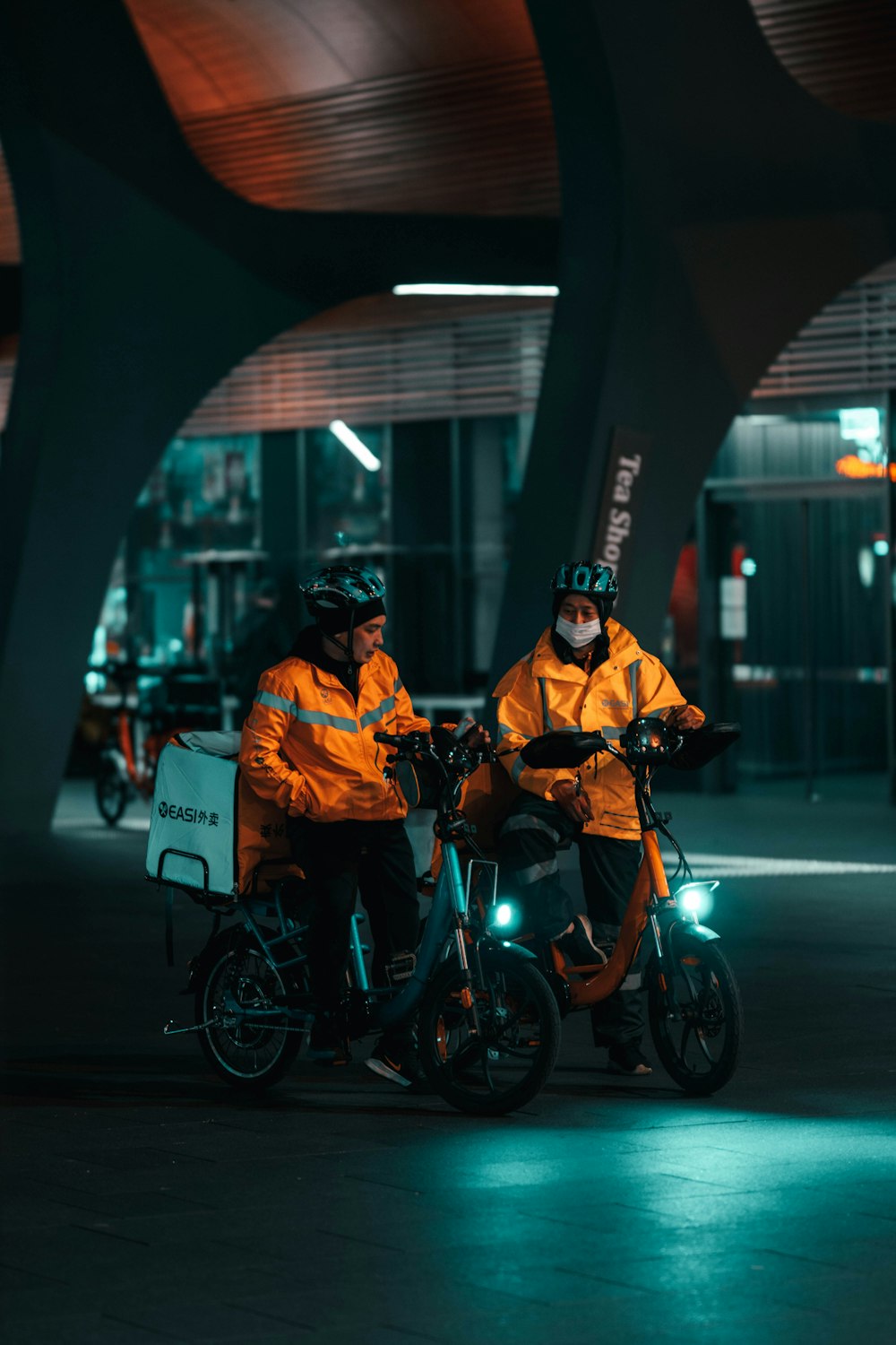 people riding on black motorcycle during night time