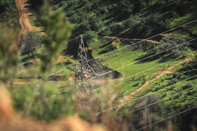 A panoramic view of a newly constructed gas-insulated substation nestled in a Scottish glen.
