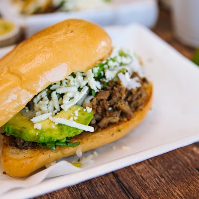 a close up of a sandwich on a plate on a table