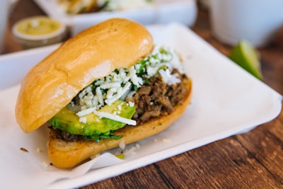 a close up of a sandwich on a plate on a table