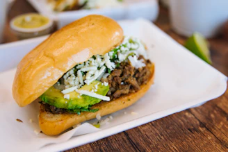 a close up of a sandwich on a plate on a table