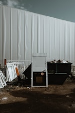 black plastic container on brown soil