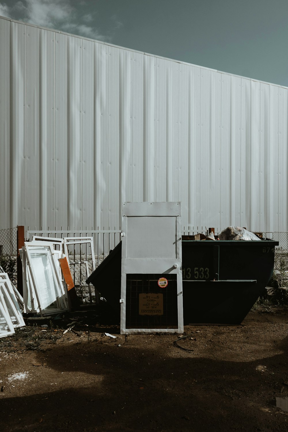 black plastic container on brown soil