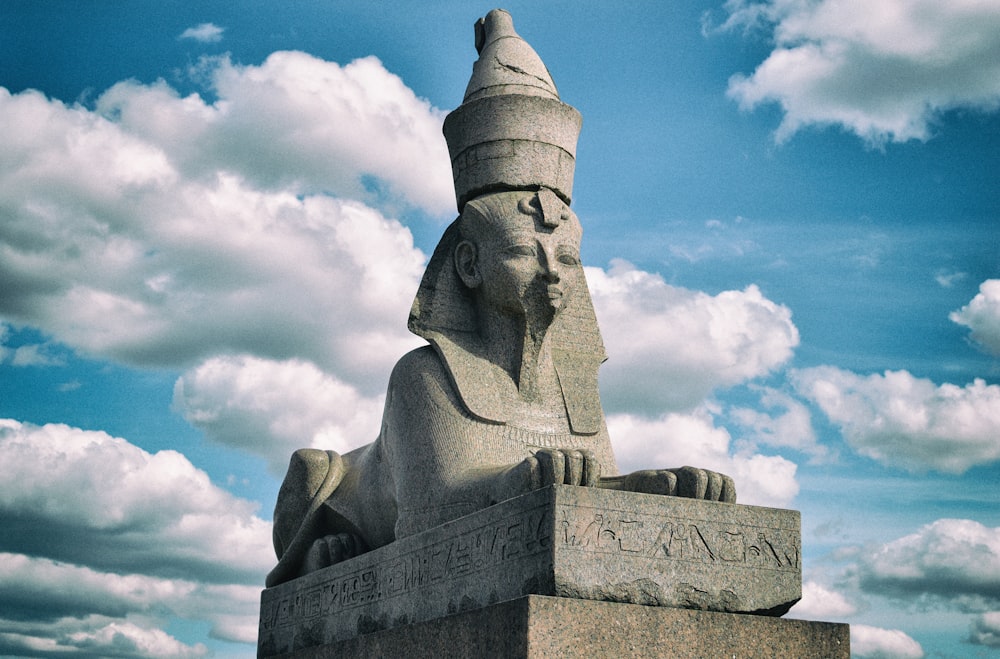 gray concrete statue under blue sky during daytime