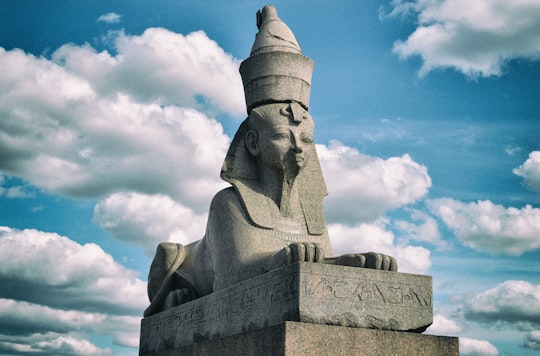 gray concrete statue under blue sky during daytime in Sphinx Russia