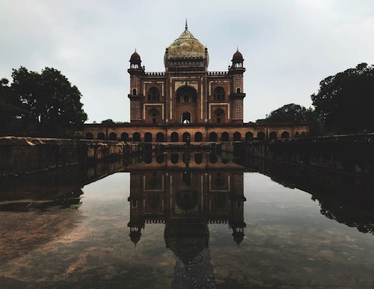 brown and beige concrete building near body of water during daytime in Safdarjung Tomb India