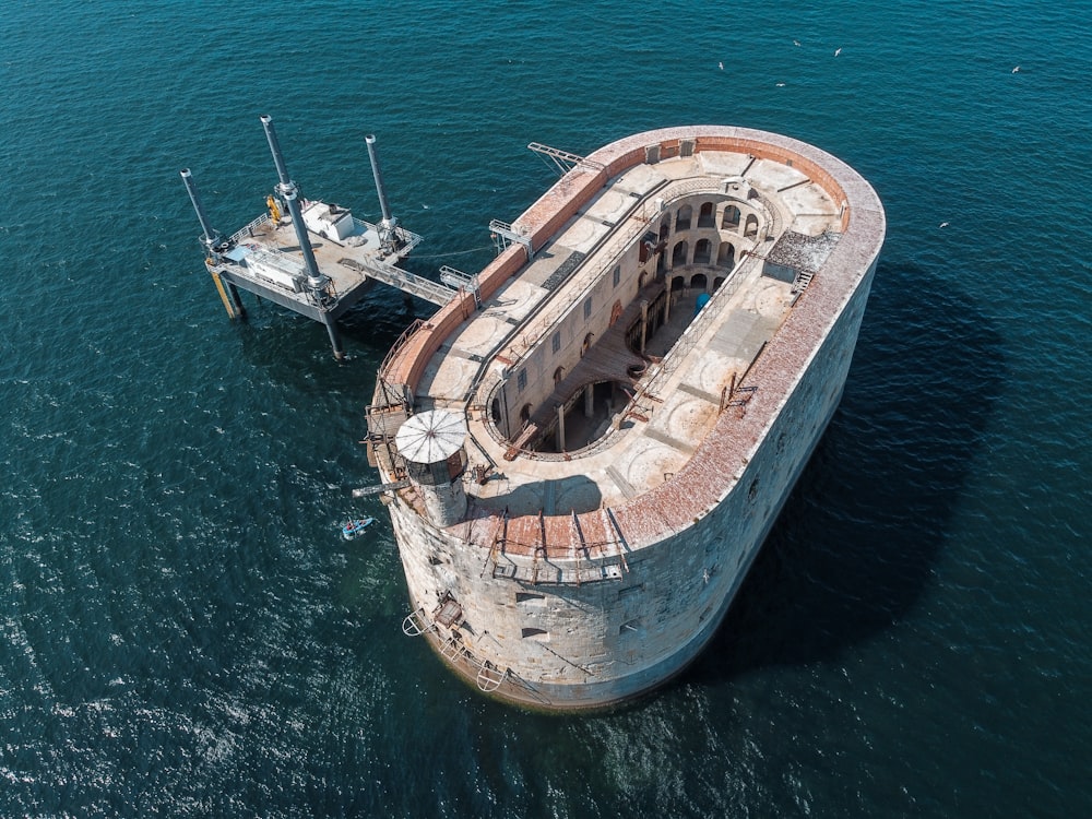 white and brown ship on sea during daytime