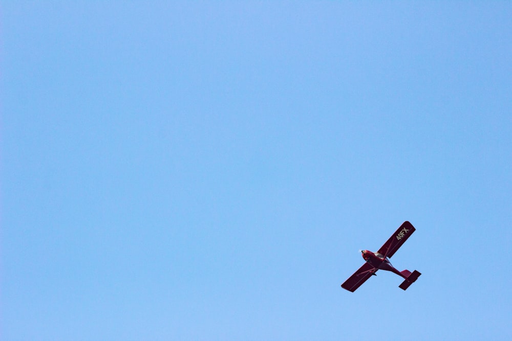 red plane in the sky