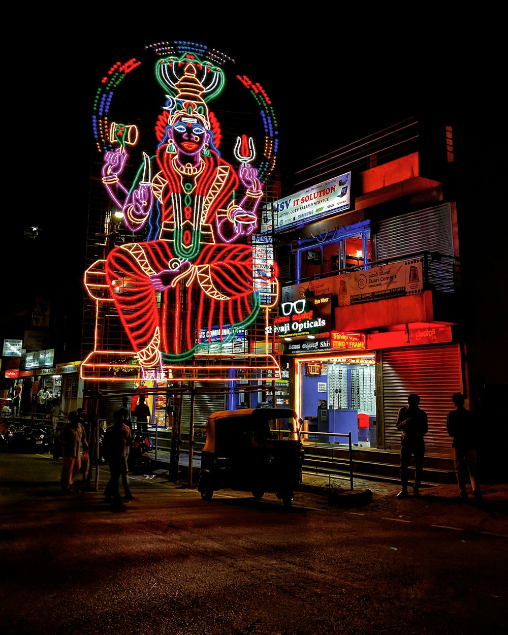 people walking on street during night time