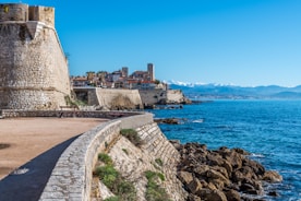 brown concrete building near sea during daytime