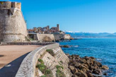brown concrete building near sea during daytime
