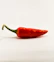 red chili on white surface