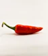 red chili on white surface