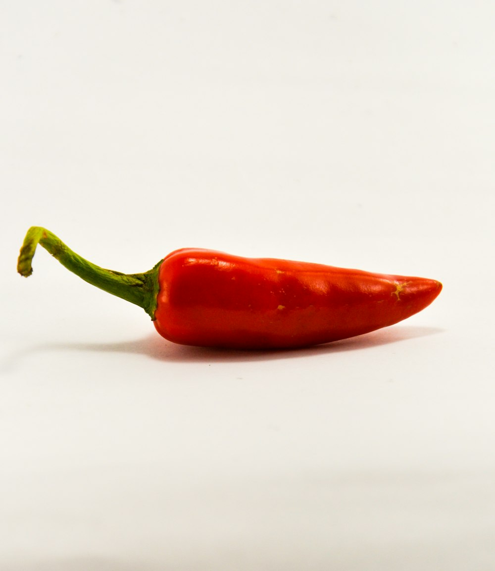 red chili on white surface