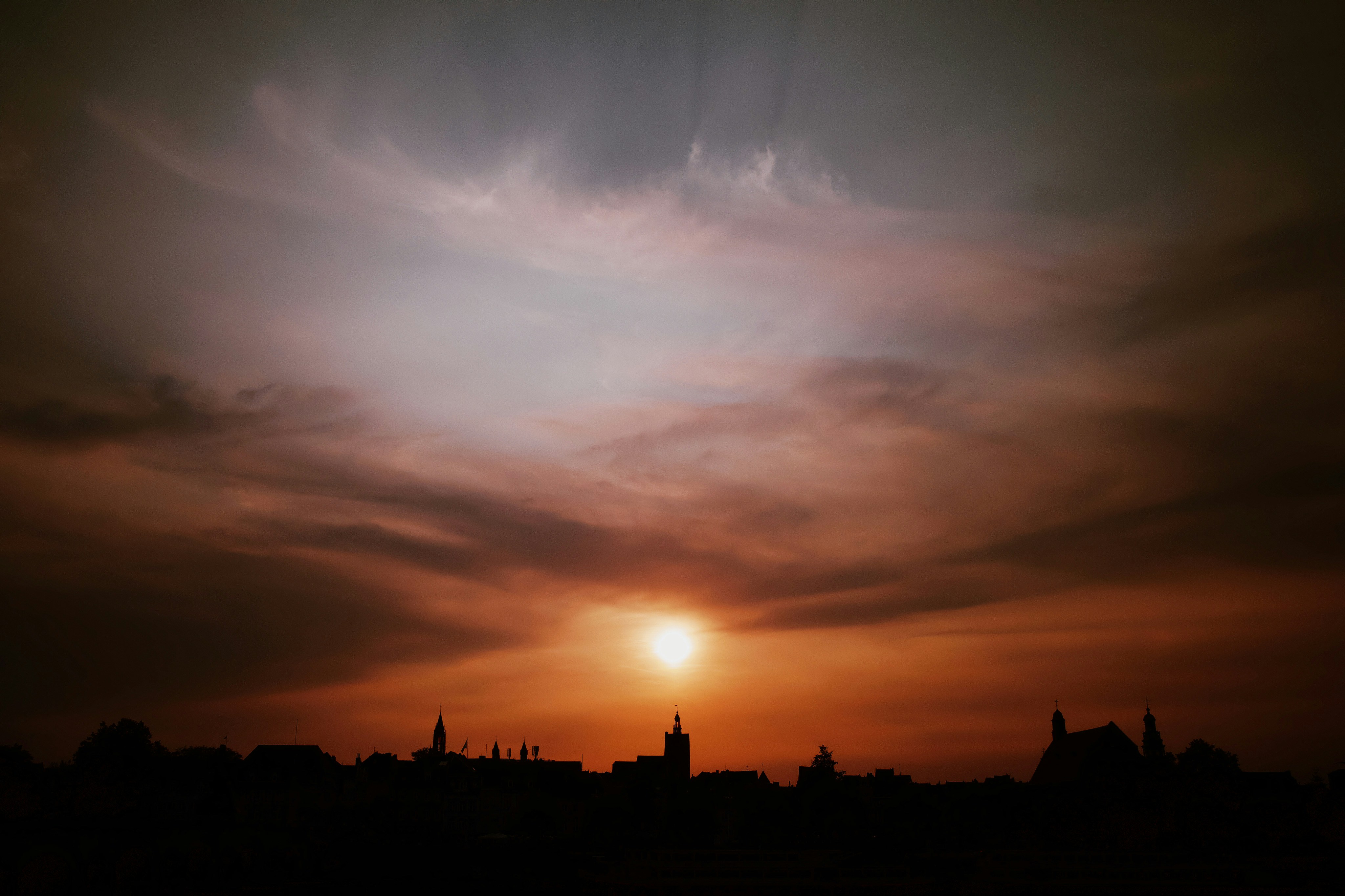 silhouette of buildings during sunset