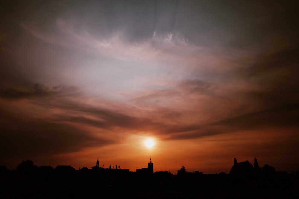 silhouette of buildings during sunset