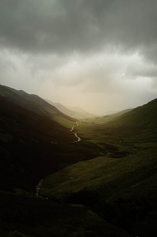 green mountains under white clouds during daytime in Lake District National Park United Kingdom