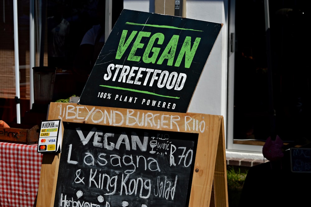 green and black wooden signage