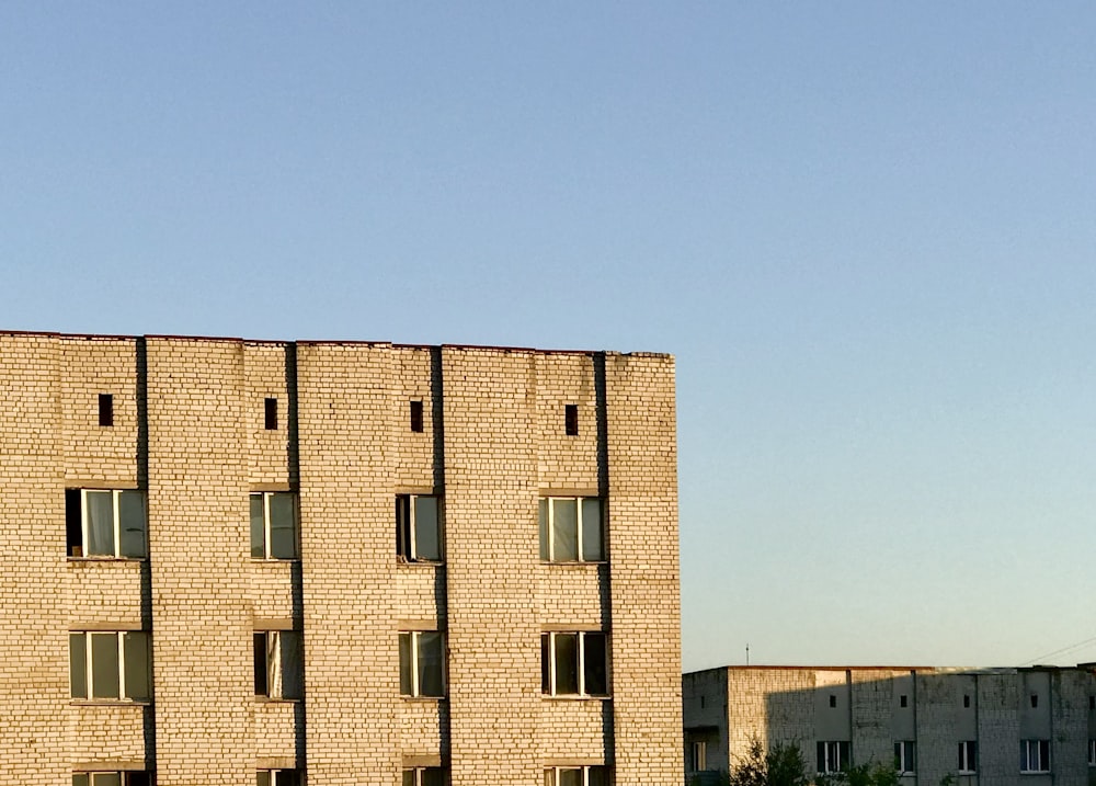 brown concrete building under blue sky during daytime