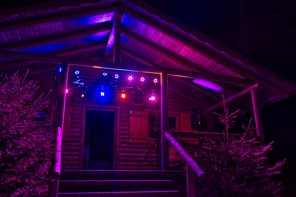 a lit up house in the dark at night