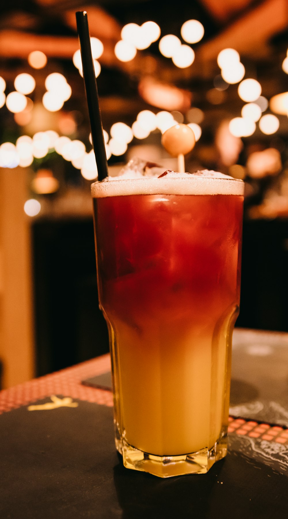 clear drinking glass with brown liquid