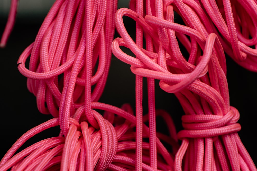 pink rope on black textile