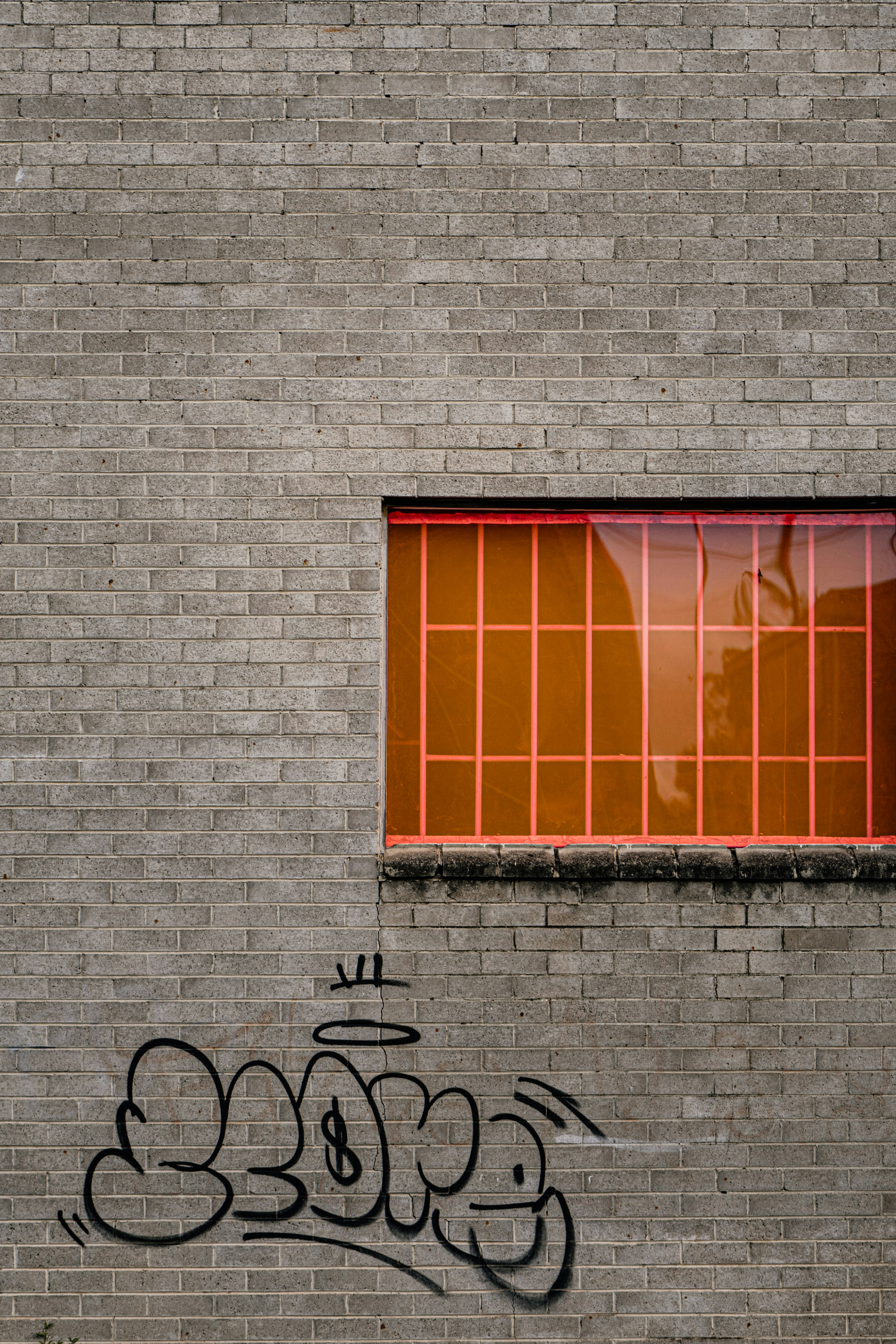 black bicycle parked beside brown wooden window