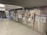 A row of ticket vending machines with the label 'Fahrkarten' in a subway station environment. The area is clean and well-lit, with metal paneling and informational maps and signage visible on the machines.