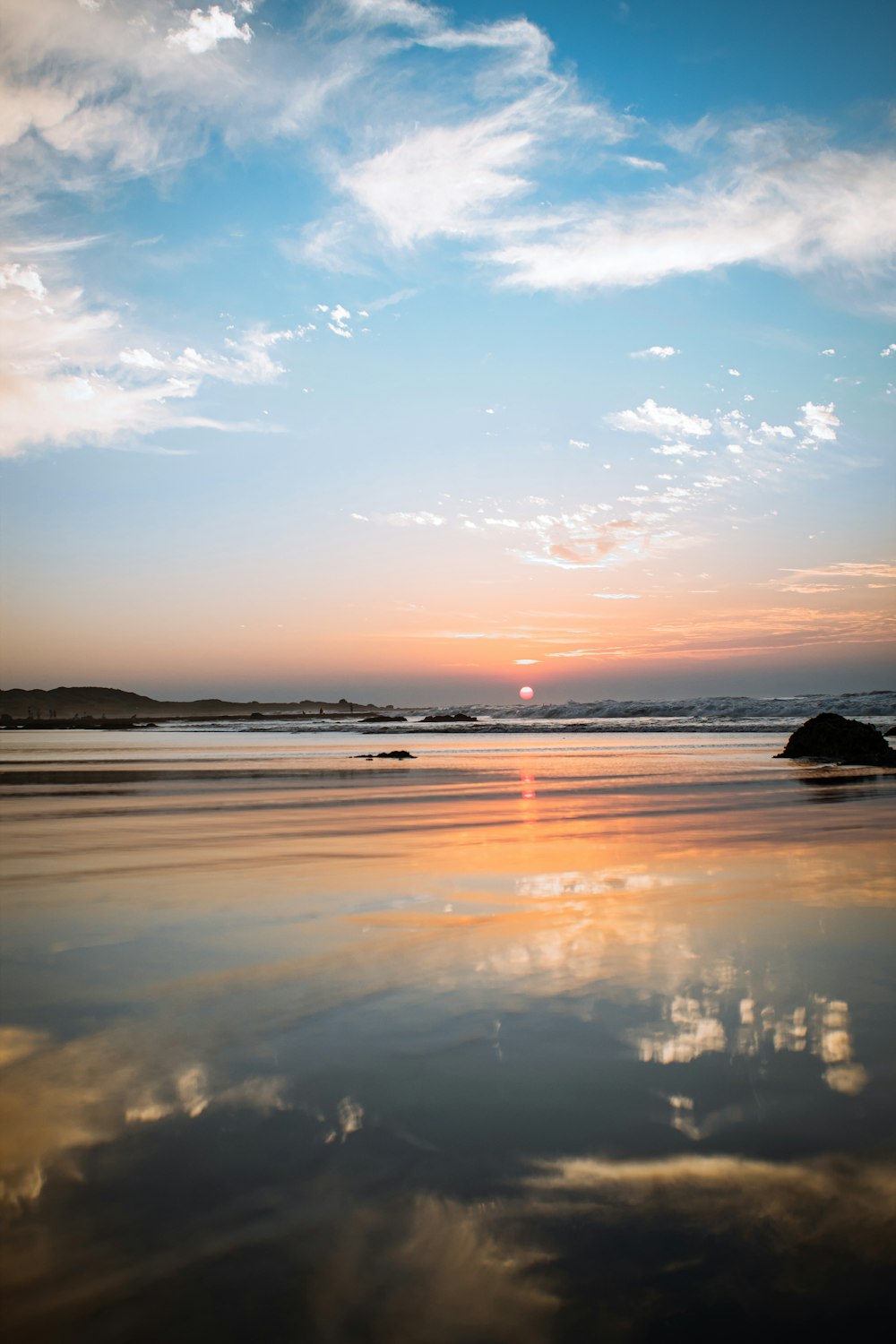 body of water during sunset