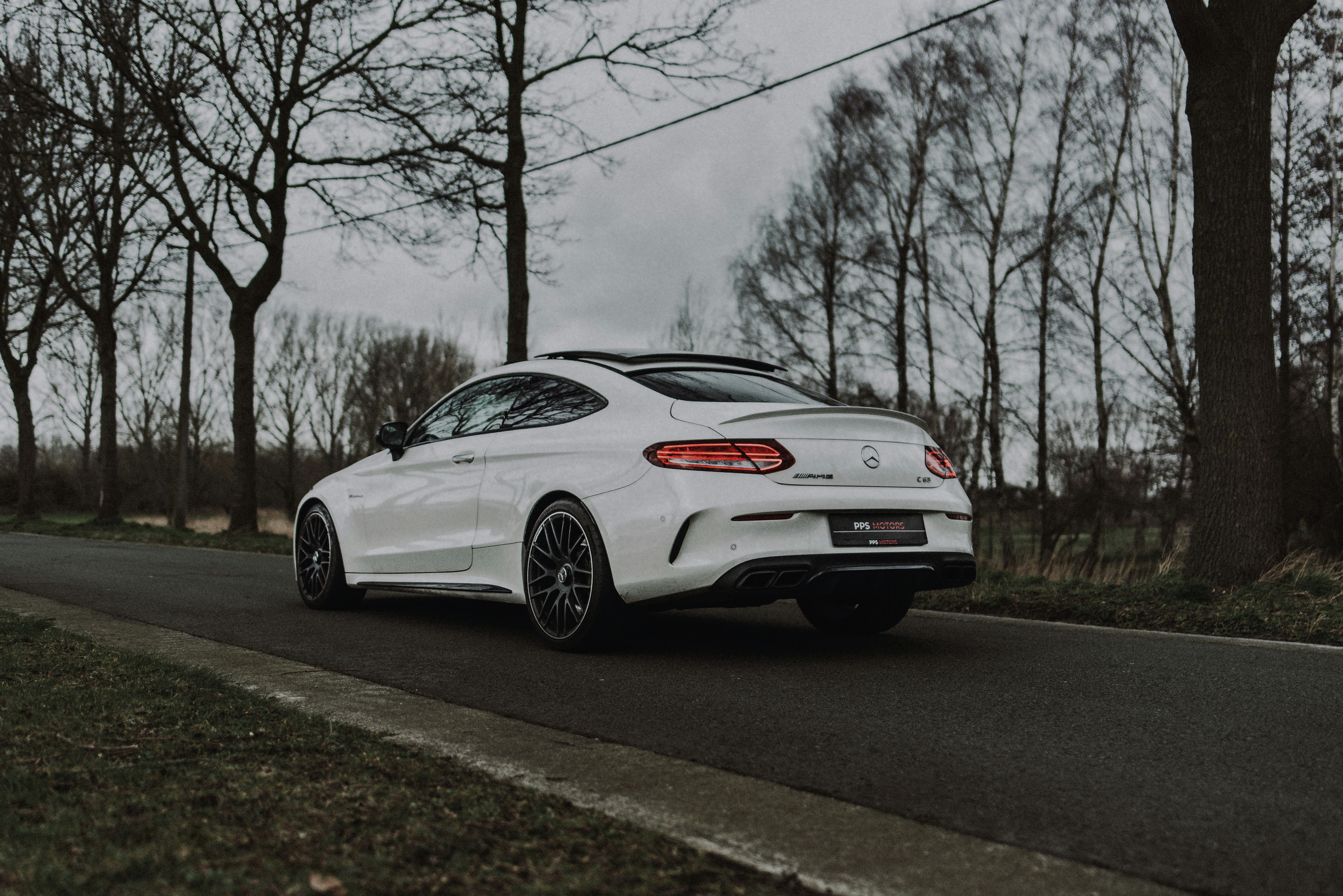 white bmw m 3 coupe on road during daytime