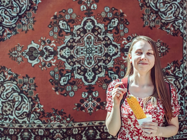 Smiling customer holding a bag of Jauhar rice in a cozy kitchen setting.