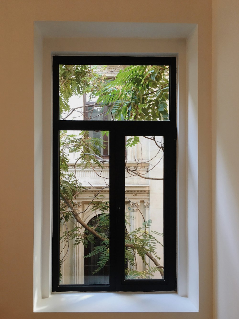 black wooden framed glass window