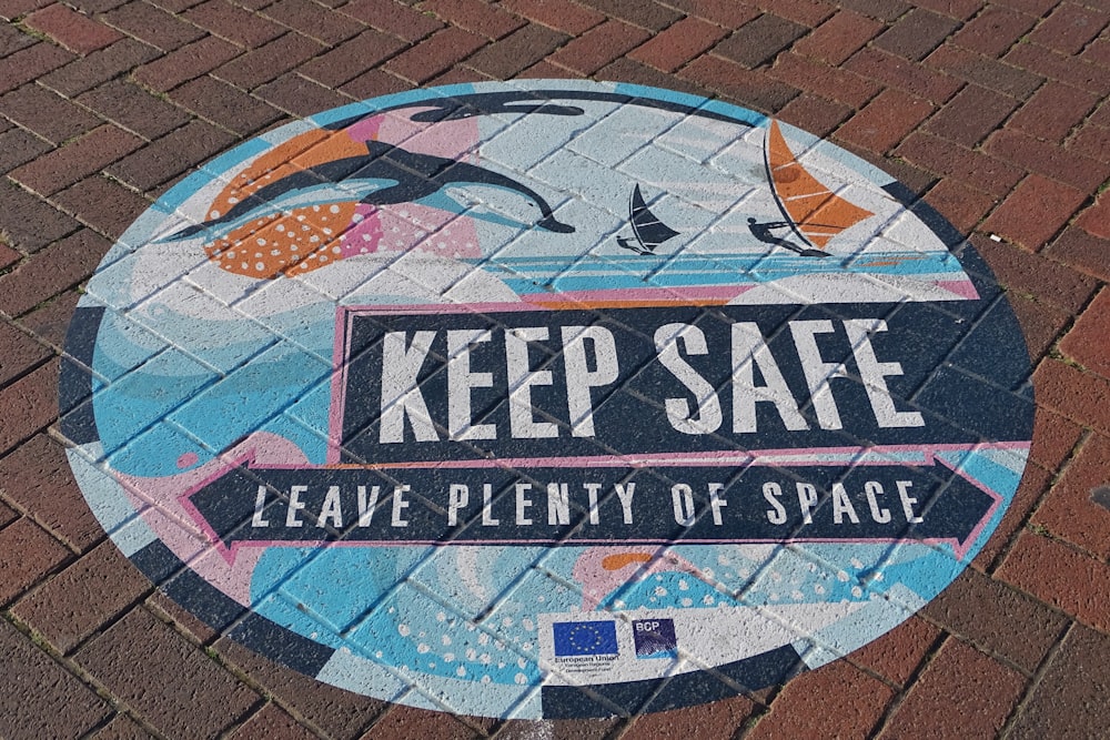 a sign that says keep safe leave plenty of space