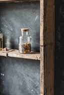 brown and black beans in clear glass jar