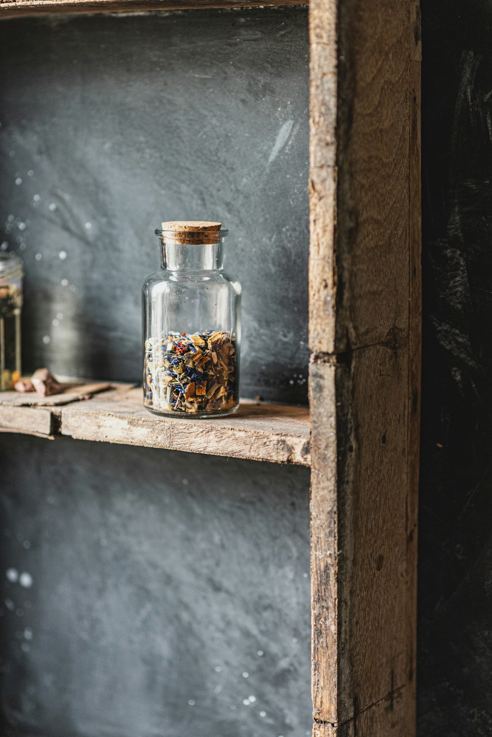 brown and black beans in clear glass jar