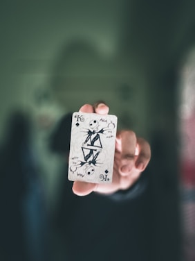 A close-up of a hand holding a custom-designed Yu-Gi-Oh! trading card with vibrant artwork.