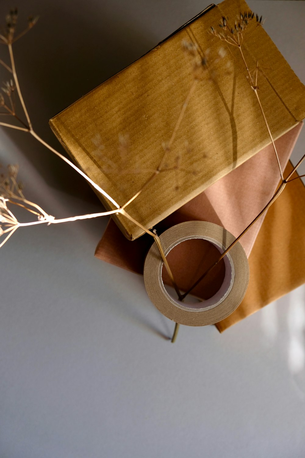 white earbuds on brown textile