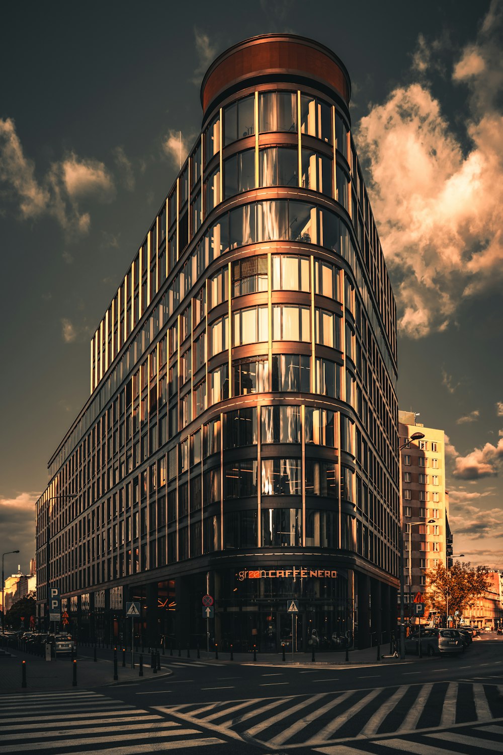 brown and black concrete building under gray sky