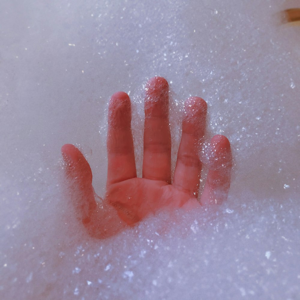 persons hand on water